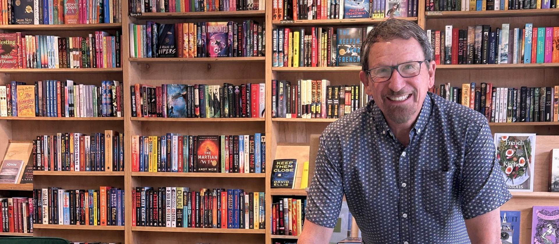 Bob Loudermilk signing copies of Never Retire at a bookstore